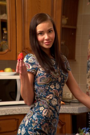 Sweetie caresses herself with strawberries on table photo 6