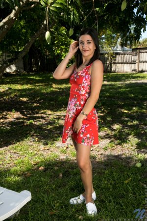 Smiling beauty takes off her pretty red dress for you photo 1