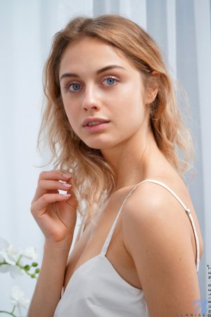 Innocent-looking small tits beauty is naked and ready photo 2