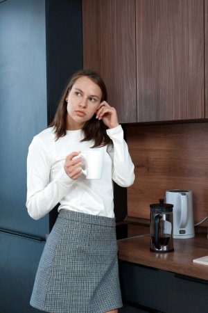 Liv Lauren undresses in the office photo 2