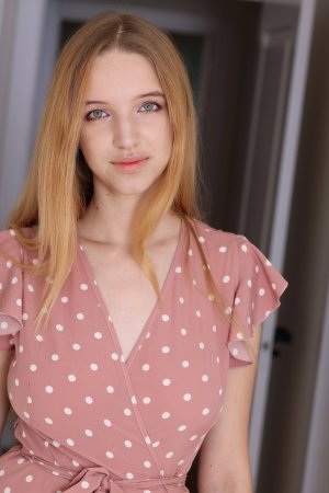 Milky fingers her pussy as she peels off her clothes photo 1